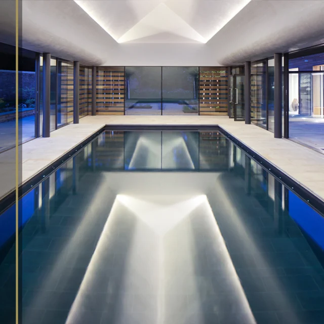 Bespoke design has few limitations. ​�​�

Once again we worked alongside @yiangouarchitects who designed this outstanding project. The defining feature of this pool building is the ceiling. A curving structure, finished in a polished venetian plaster, has been designed to give the impression that the roof is floating, with the ceiling visually detached from the columns holding it all up.

There are no lights piercing this sleek, smooth surface. Hidden strips of tiny LEDs light the top section of ceiling which appears to glow, thanks to the light reflecting down off the polished plaster.

To ensure that the purity of the building was not diluted, Guncast made every effort to ensure the detailing of all grilles, switches, speakers, lights, alarms, detectors and control panels that come with modern living were either concealed entirely or designed in a way to ensure they remained unnoticed.

 The brief was to create a place to retreat to and relax in, a serene environment with no distractions, where you lie relaxing in your dark, bottomless pool looking up at the curved, floating “sky” above.
 
#SwimmingPoolDesign #LuxuryDesign #LuxuryLifestyle #BespokeSwimmingPools #Swimmingpool #Architects #Retreat #Guncast