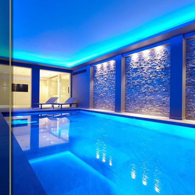 Are you thinking about building a new pool or refurbishing  a tired one?

If so then lighting should be high up on your list of priorities. Not only do the right lights illuminate your pool at night for stunning effect, they also have practical benefits too.

Extend your swim window - Fancy a sunset dip or a swim once the suns gone down? If your pool is lit you can swim anytime of the day or night

Enhanced Safety - Proper lighting helps prevent accidents by illuminating the pool area, making it easier to see the pool's edges and avoid slips and falls. 

Highlighting Features - Pool lighting can accentuate architectural elements, water features, and landscaping around the pool. It helps showcase these features and adds depth and dimension to your back garden.

Guncast’s specialist design team can help you decide which lighting options would work for you and your pool

#SwimmingPoolLighting #LuxurySwimmingPools #SwimmingPoolRefurbishment #SwimmingSafety #SwimmingPoolFeatures #Guncast