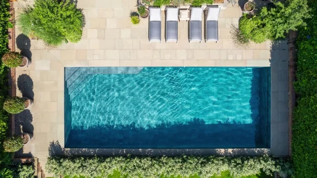 It’s time to think about winterising your pool.

As the cooler months approach, it's essential to properly close down your outdoor swimming pool.  Here are some essential tips to get you started:

• Thoroughly clean your pool, removing debris and vacuuming to make sure the pool is clean of any dirt or algae.
• Balance pH, alkalinity, and calcium levels to prevent corrosion, scaling, or damage to the pool. Add a chlorine shock treatment to kill any lingering bacteria and prevent algae growth during winter.
• Reduce water levels below the skimmer opening to prevent water from freezing and causing damage.
• Drain water from the pump, filter, and heater to prevent freezing, which can cause cracking and damage. If possible, use a blower to remove water from the plumbing lines.
• Invest in a high-quality winter pool cover to keep debris out and protect the water from winter elements. Ensure the cover is secure, with water bags or cover clips to keep it in place.
• Check the pool periodically to ensure the cover remains intact and water levels don’t rise too high. It’s important to continue regular maintenance over the winter.

Following these steps will help protect your pool from winter damage and make reopening it in the spring much easier!

#PoolMaintenance #WinterPoolPrep #ProtectYourPool #PoolClosing #SeeYouNextSummer #OutdoorSwimmingPool #Guncast